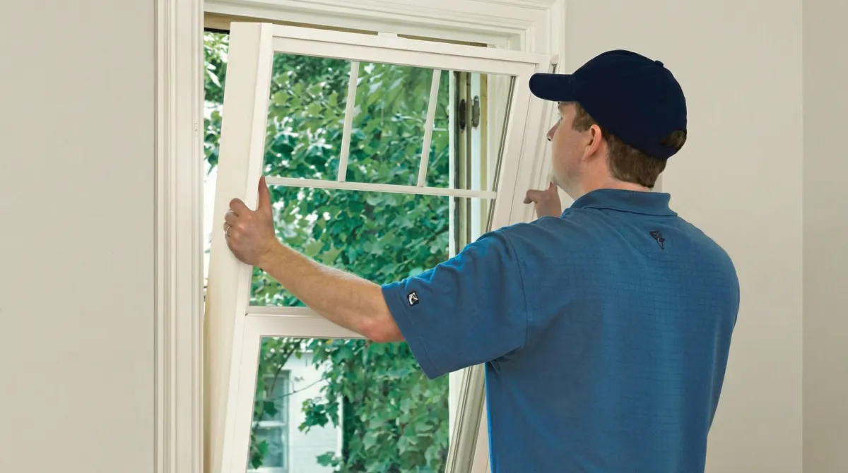 Professional contractors performing a residential window insulation and replacement service in New Orleans, LA